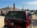 Used Topper - 2019-2026 Ram 1500 5.7 ft bed - Delmonico Red